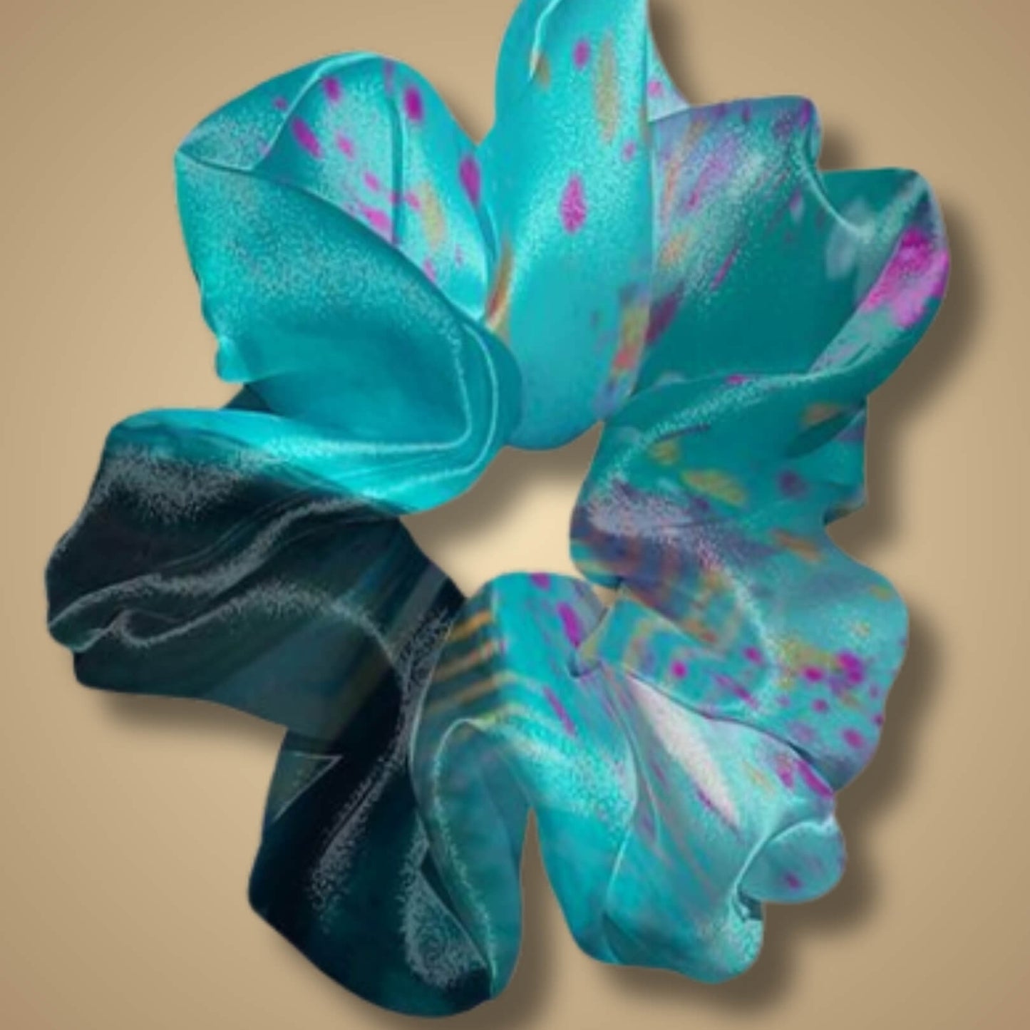 Closeup of the Hyperfocus scrunchie showing the vivid blue and purple streaks and rich fabric detail.