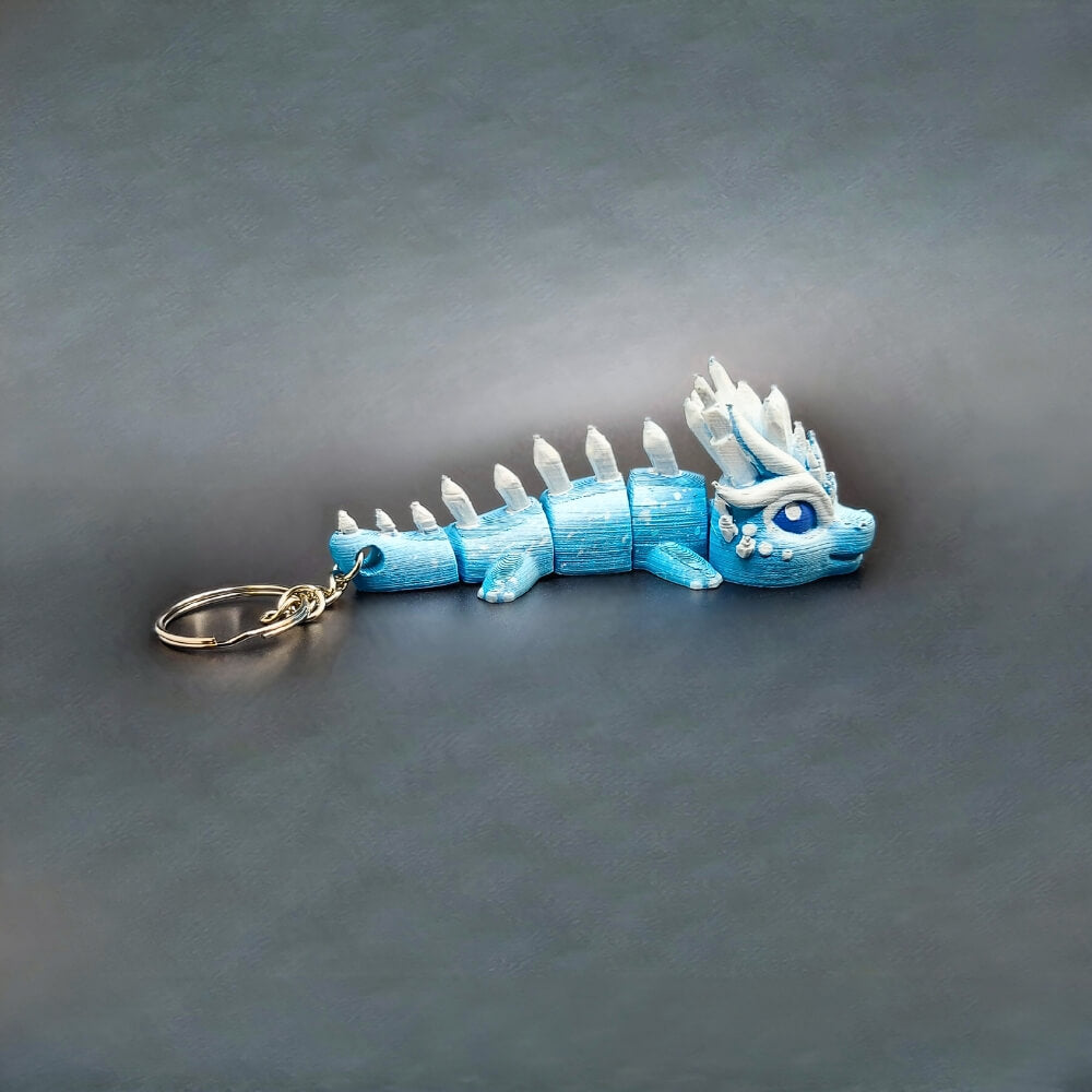 Side profile of Eryndra Ice Dragon keychain showing frost-inspired patterns