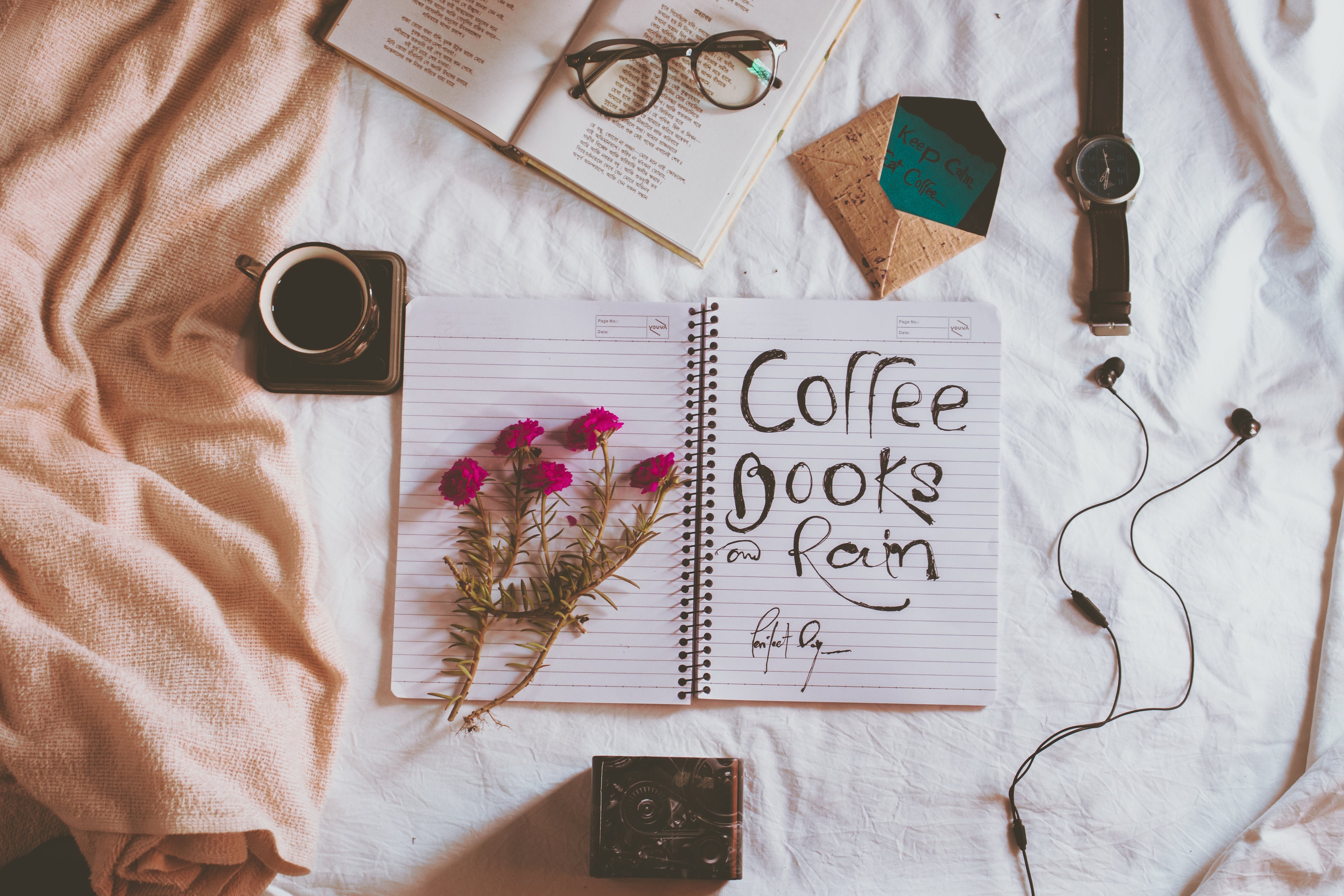 notebook-with-coffee-books-and-rain