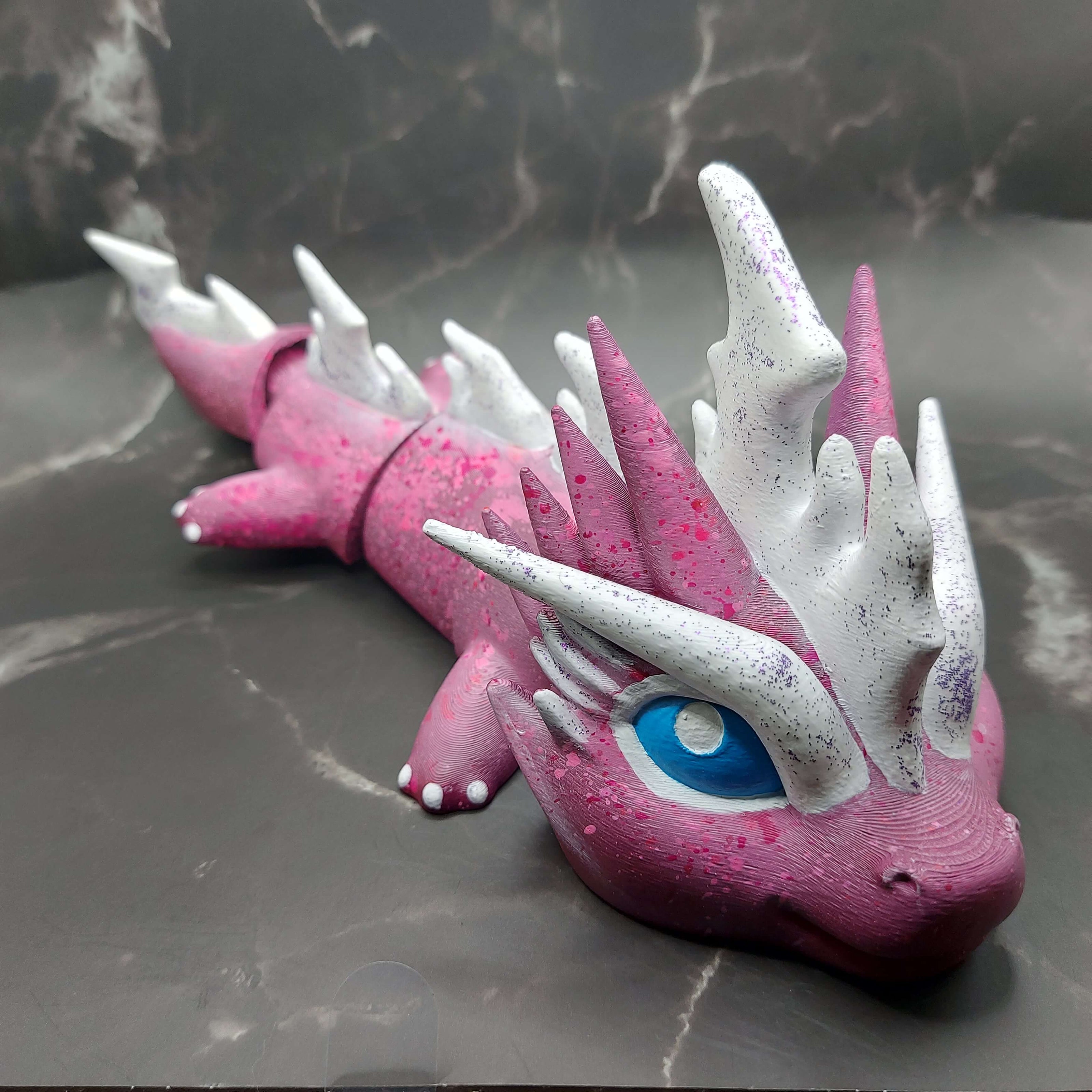 Pink and white custom large dragon figurine with purple glitter accents, hand-painted and 3D-printed by Kylyne’s Custom Treasures.