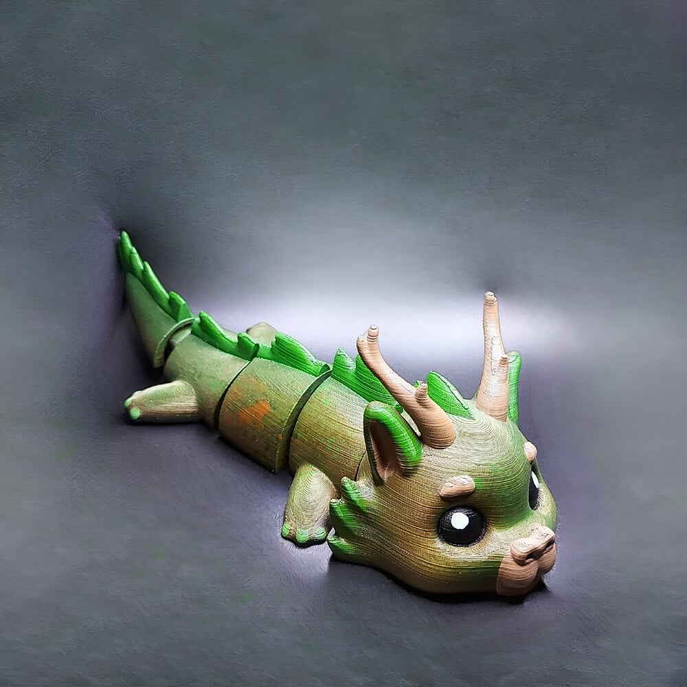 Side view of Dasyra the Forest Dragon with leafy green tones, 3D-printed and hand-painted for nature-inspired charm
