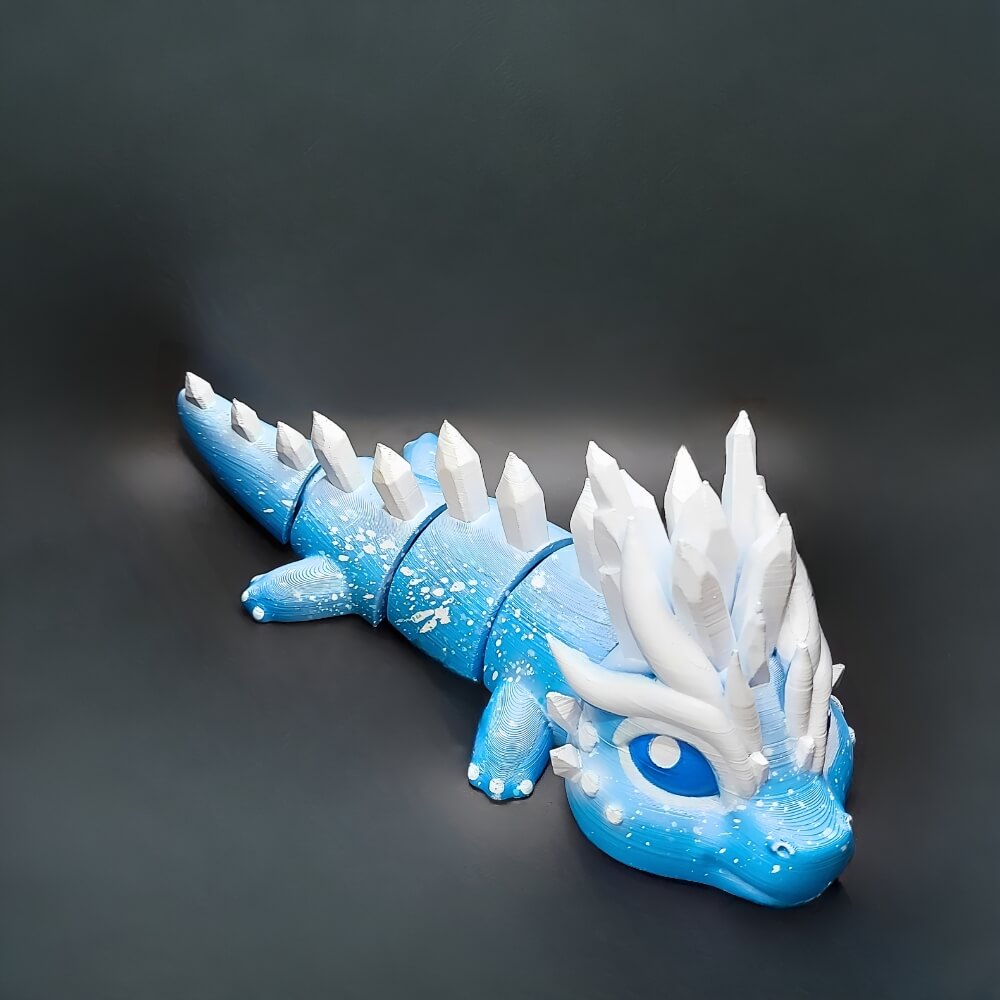 Full-body view of Eryndra the Ice Dragon with hand-painted frosty blue scales and icy white crystal horns.