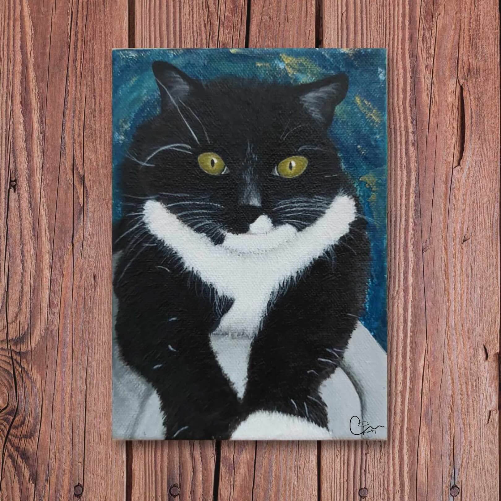 Custom hand-painted cat portrait of Willow, a black and white tuxedo cat with bright yellow eyes, created by Kylyne’s Custom Treasures. Artwork displayed on a wooden background with pink roses above.