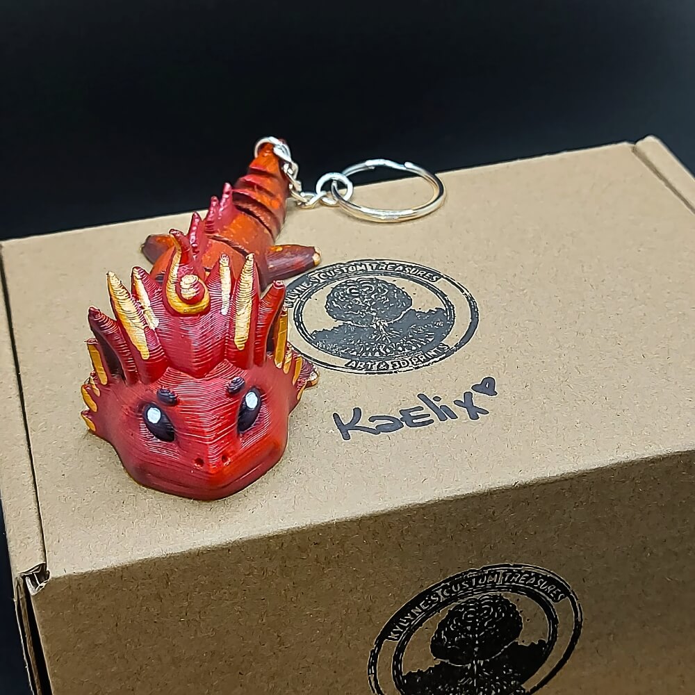 Kaelix Fire Dragon keychain with eco-friendly packaging and presentation box