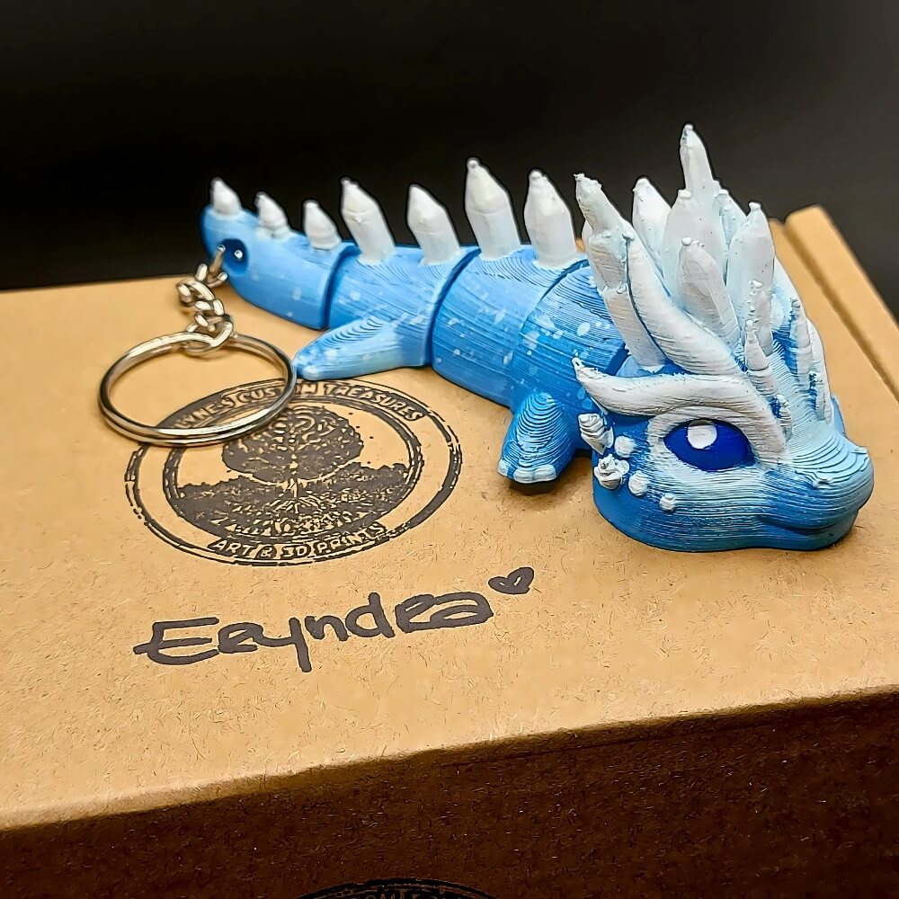 Eryndra Ice Dragon keychain with eco-friendly packaging and presentation box