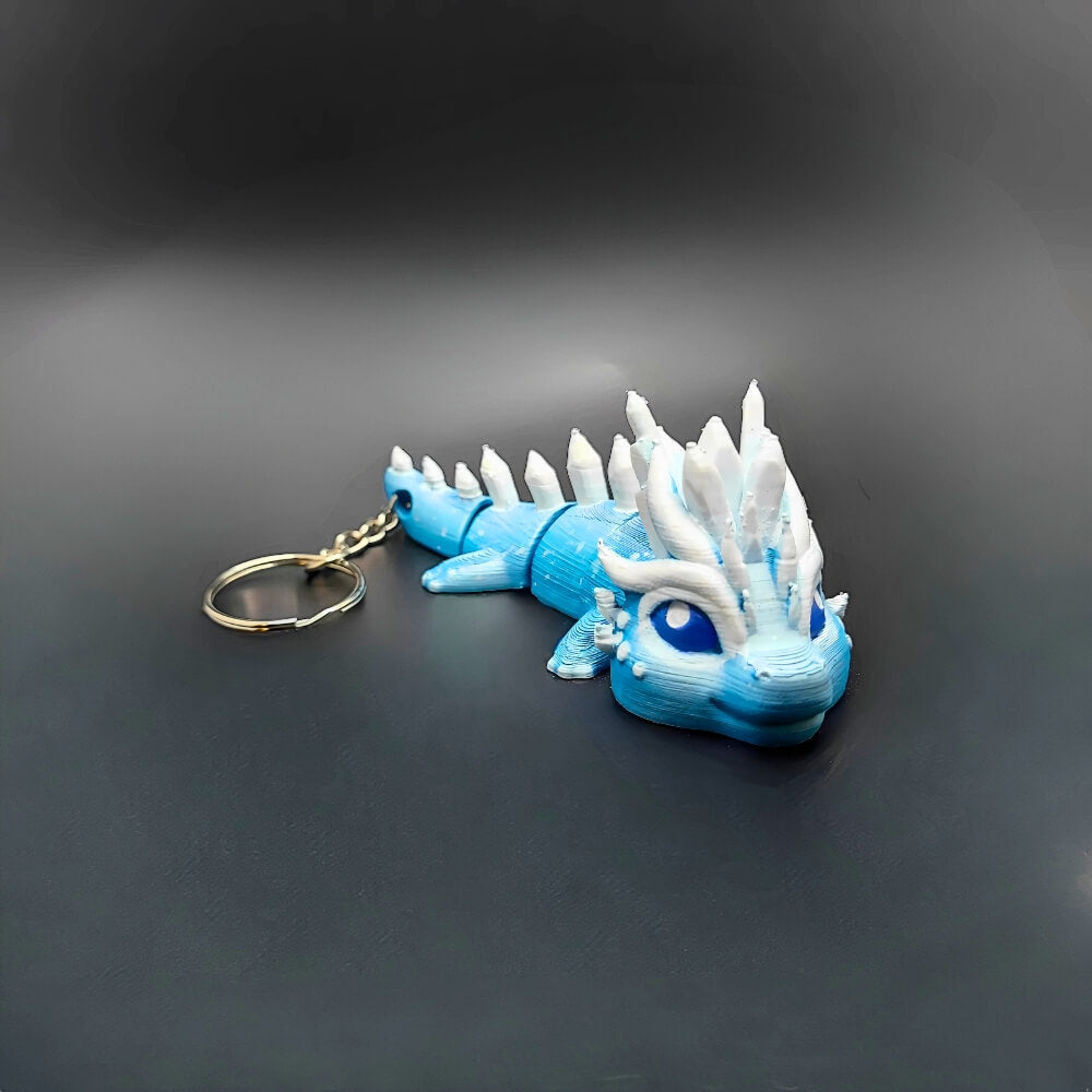 Top view of Eryndra Ice Dragon keychain displaying intricate ice crystal details