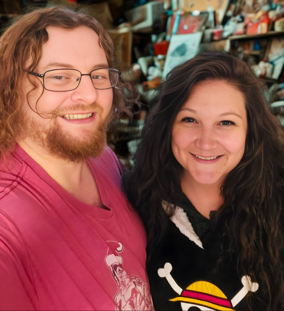 Two co-founders smiling together in a creative studio workspace