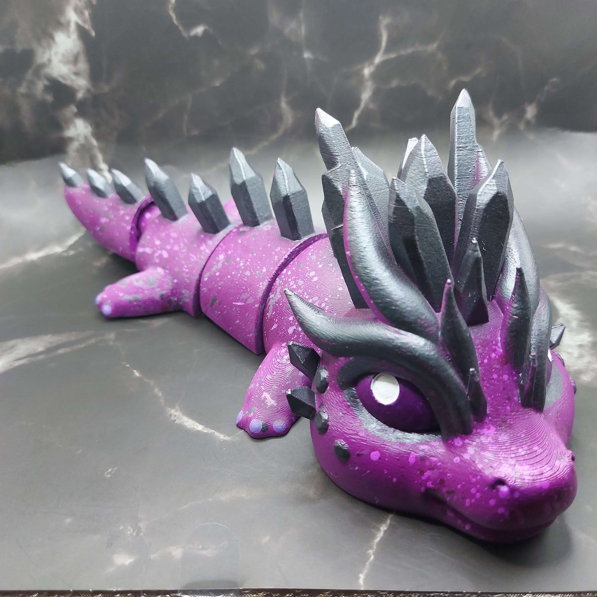 Purple custom large dragon figurine with black and white details, hand-painted and 3D-printed by Kylyne’s Custom Treasures.