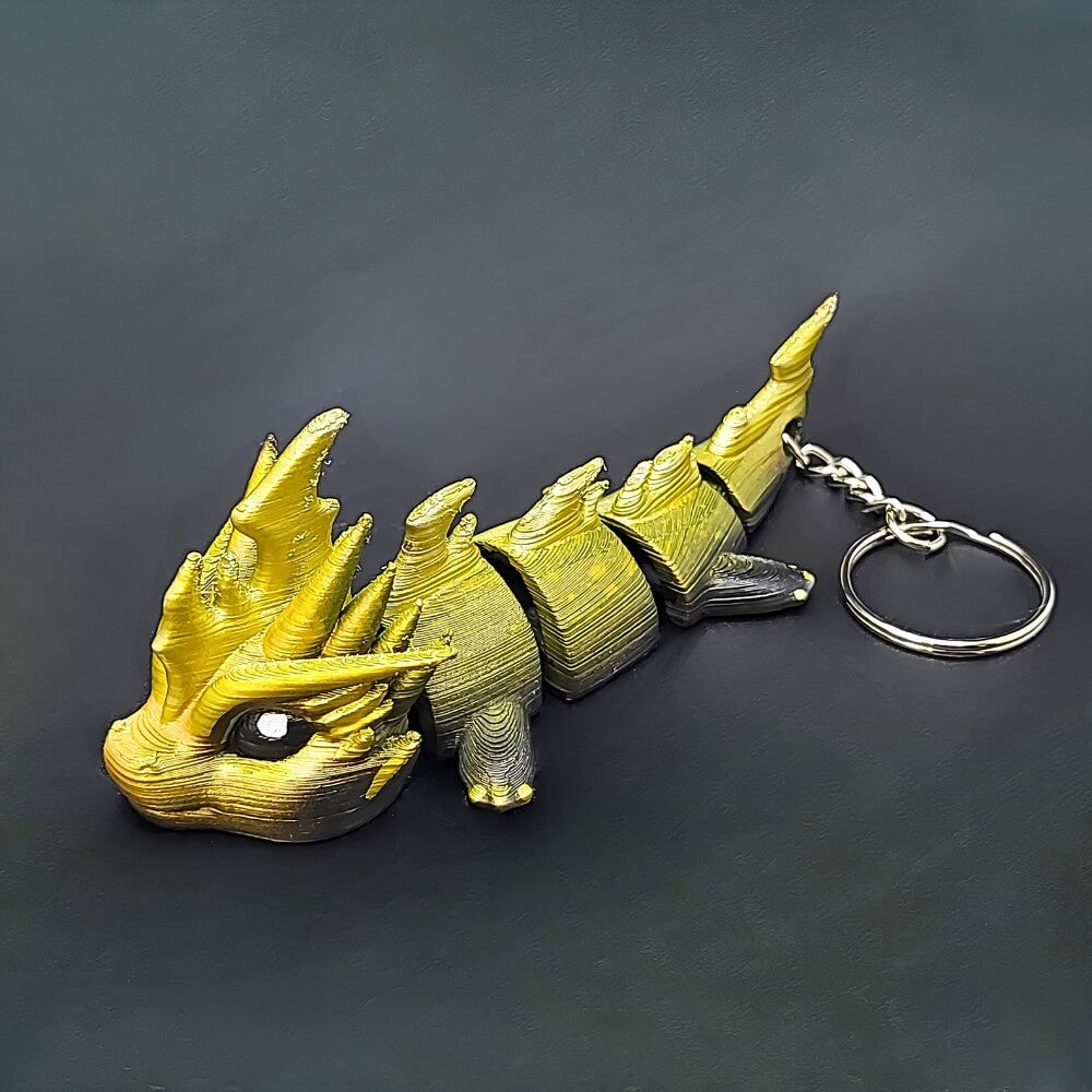 Side profile of Zoryn Thunder Dragon keychain showing articulated design and metallic finish