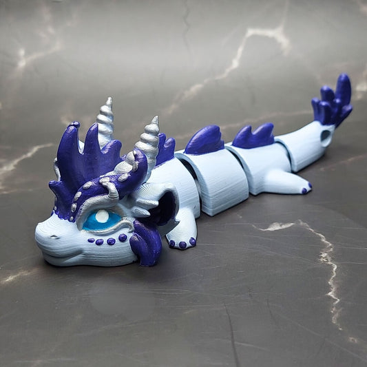 Zephir the Wind Elemental Dragon of Drakora, 3D-printed and hand-painted by Kylyne’s Custom Treasures, displayed on a marble background.