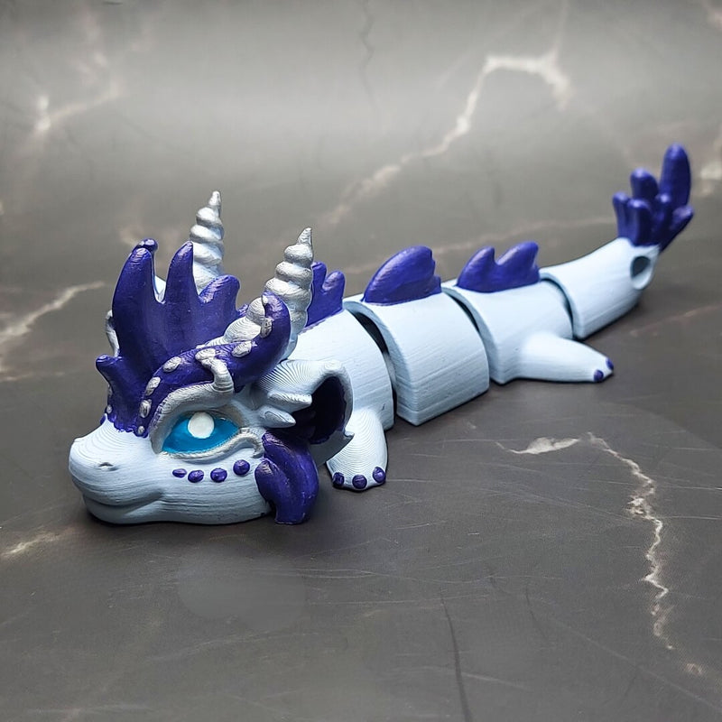 Zephir the Wind Elemental Dragon of Drakora, 3D-printed and hand-painted by Kylyne’s Custom Treasures, displayed on a marble background.