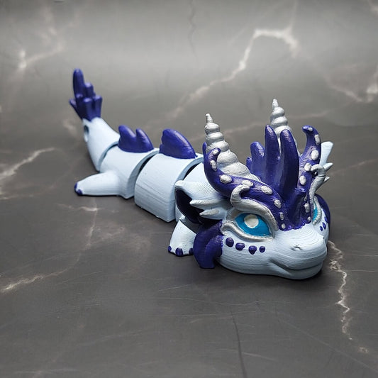 Zephir the Wind Elemental Dragon of Drakora, hand-painted and 3D-printed by Kylyne’s Custom Treasures, shown on a marble surface.